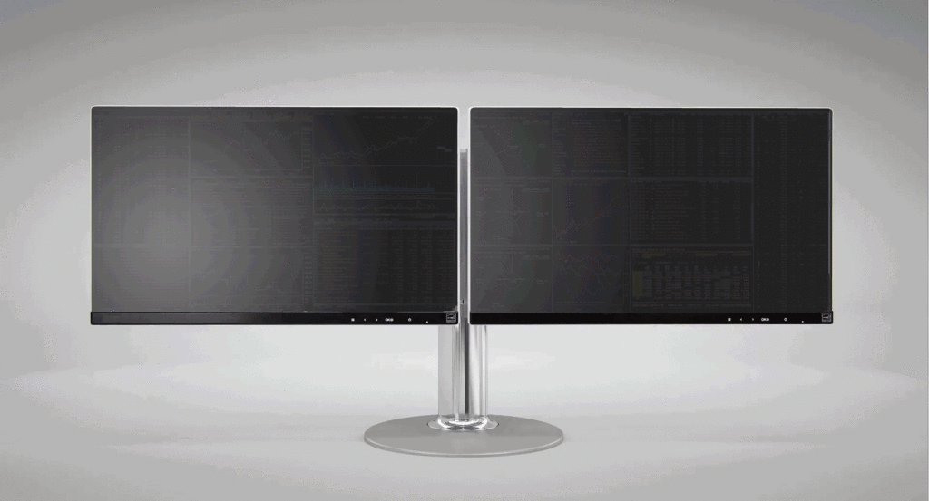 Render of double monitors attached to a single chrome stand. Monitors show a faint palimpsest of an software interface